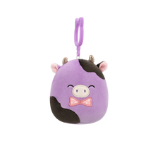 Squishmallows con clip-on Alexie la mucca viola e nera con papillon, 9 cm